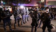 Police stand in front of demonstrators during a protest the day after Election Day in Portland, Oregon, U.S., November 4, 2020. REUTERS/Goran Tomasevic