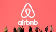 Small toy figures are seen in front of diplayed Airbnb logo in this illustration taken March 19, 2020. REUTERS/Dado Ruvic/Illustration/File Photo
