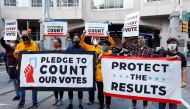 Demonstrators protest at the site Eric Trump was supposed to hold a news conference but was postponed, in Center City, Philadelphia, Pennsylvania, U.S., November 4, 2020. REUTERS/Rachel Wisniewski
