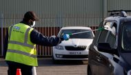 An NHS staff member works at a coronavirus disease (COVID-19) testing centre in Liverpool, Britain, November 6, 2020. REUTERS/Phil Noble