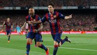 Lionel Messi celebrates with Dani Alves after scoring the first goal for Barcelona Reuters / Albert Gea/File Photo