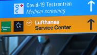 Signs lead the way towards the COVID-19 testing centre and the service desk of German air carrier Lufthansa at Frankfurt Airport as the spread of the coronavirus disease (COVID-19) continues in Frankfurt, Germany, November 6, 2020. REUTERS/Kai Pfaffenbach