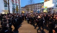 German police face protesters taking part in a demonstration called for by the initiative 