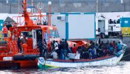 One hundred and twenty nine migrants wait to disembark as they are rescued by a Spanish coast guard vessel in the port of Arguineguin, after dozens of them arrived to the south part of the island of Gran Canaria, Spain, November 2, 2020. REUTERS/Borja Sua