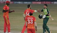 Pakistan's Haider Ali (R) interacts Zimbabwe's Ryan Burl after winning the second Twenty20 cricket match between Pakistan and Zimbabwe at the Rawalpindi Cricket Stadium in Rawalpindi on November 8, 2020. / AFP / Aamir QURESHI
