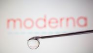 Moderna's logo is reflected in a drop on a syringe needle in this illustration taken November 9, 2020. REUTERS/Dado Ruvic/Illustration