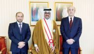 H E Dr. Mohammed bin Saleh Al Sada with officials during the event.