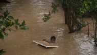 Boy holds onto styrofoam as he wades through neck-deep flood caused by Typhoon Vamco, in Marikina, Metro Manila, Philippines, November 12, 2020. REUTERS/Eloisa Lopez