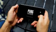 A boy plays Tencent Holdings' PUBG videogame on his mobile phone at a cafe in New Delhi, India, September 3, 2020. REUTERS/Adnan Abidi/File Photo