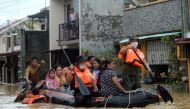 Residents on a rescue boat are evacuated from their flooded houses following Typhoon Vamco, in Rizal Province, Philippines, November 12, 2020. REUTERS/Lisa Marie David
