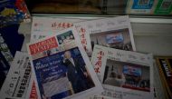Newspaper front pages lead with the victory of Joe Biden in the US presidential election, at a news stand in Beijing on November 9, 2020. / AFP / Noel Celis
