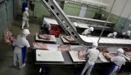 FILE PHOTO: Employees work at the assembly line of jerked beef at a plant of JBS S.A, the world's largest beef producer, in Santana de Parnaiba, Brazil December 19, 2017. REUTERS/Paulo Whitaker
