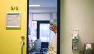 A doctor takes care of a Covid-19 patient in the intensive care unit at the University Hospital of Aachen, western Germany, on November 10, 2020 during the novel coronavirus (Covid-19) pandemic. AFP / Ina Fassbender 