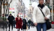 People with protective masks walk down a shopping street during the second lockdown as the coronavirus disease (COVID-19) outbreak continues in Vienna, Austria, November 13, 2020. REUTERS/Lisi Niesner
