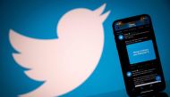 FILE PHOTO: The logo of US social network Twitter displayed on the screen of a smartphone and a tablet in Toulouse, southern France. AFP / Lionel BONAVENTURE
