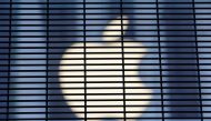 File photo: The Apple logo is seen through a security fence erected around the Apple Fifth Avenue store in Manhattan, New York City, U.S., November 5, 2020. Reuters/Andrew Kelly/File Photo
