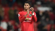 (Files) Manchester United's English striker Marcus Rashford applauds supporters on the pitch after the English Premier League football match between Manchester United and Aston Villa at Old Trafford in Manchester, north west England. AFP / Oli Scarff  