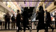 Iranian People wearing protective masks as they walk at a store, amid the outbreak of the coronavirus disease (COVID-19), in Tehran, Iran November 11, 2020. Majid Asgaripour/WANA 