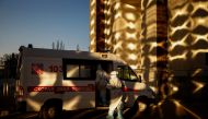Medical specialists get into an ambulance outside a pavilion of the Exhibition of Achievements of National Economy (VDNH), which was converted into a temporary hospital for people suffering from the coronavirus disease (COVID-19), in Moscow, Russia Novemb