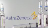 A test tube labelled with the word Vaccine is seen in front of AstraZeneca logo in this illustration taken, September 9, 2020. REUTERS/Dado Ruvic/Illustration/File Photo