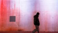 A man wearing a protective face mask, as the global outbreak of the coronavirus disease (COVID-19) continues, walks under a bridge in Yonkers, New York, U.S., November 17, 2020. REUTERS/Shannon Stapleton/Files
