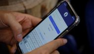A Facebook user logs in on his mobile at a cafe in Hanoi, Vietnam November 19, 2020. REUTERS/Kham
