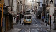 A tram is pictured on the empty street during the coronavirus disease (COVID-19) outbreak, in downtown Lisbon, Portugal October 31, 2020. REUTERS/Rafael Marchante/File Photo