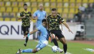 A player of Al Wakrah (in blue) chases a Qatar SC player during their QNB Stars League Round 6 clash at Suheim Bin Hamad Stadium yesterday. Qatar SC won 1-0. 