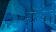 A diver is seen in the deepest pool in the world with 45.5-metre (150-foot) located in Mszczonow about 50 km from Warsaw, November 21, 2020. AFP / Wojtek Radwanski 