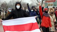 Opposition supporters parade through the streets during a rally to protest against police violence and Belarus presidential election results in Minsk on November 22, 2020. AFP 