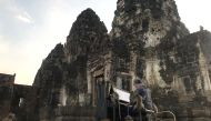 British musician Paul Barton plays the piano for monkeys that occupy abandoned historical areas in Lopburi, Thailand November 21 2020. Reuters/Prapan Chankaew