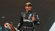 November 15, 2020 Mercedes' Lewis Hamilton celebrates on the podium with a trophy after winning the race and the world championship Pool via REUTERS/Ozan Kose/File Photo