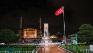 An empty Taksim square is pictured during the weekend curfew on November 21, 2020 in Istanbul. A partial curfew that apply from 8 pm until 10 am to fight rising coronavirus infections and growing deaths starts in Turkey. / AFP / Ozan KOSE
