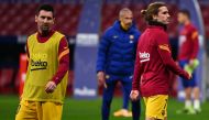 Barcelona's French midfielder Antoine Griezmann (R) and Barcelona's Argentine forward Lionel Messi warm up before the Spanish League football match between Club Atletico de Madrid and FC Barcelona at the Wanda Metropolitano stadium in Madrid on November 2