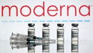 This illustration picture taken on November 17, 2020 shows vials with Covid-19 Vaccine stickers attached and syringes with the logo of US biotechnology company Moderna on November 17, 2020. The European Union said on November 24, 2020 it would sign a sixt