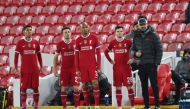  Liverpool's Roberto Firmino, Diogo Jota, Fabinho and Andrew Robertson wait to come on as manager Juergen Klopp looks on... Reuters/Laurence Griffiths