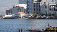 Lebanese fishermen are pictured near the promenade in the capital Beirut on November 24, 2020. / AFP / JOSEPH EID
