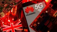 FILE PHOTO: The British flag and a smartphone with a Huawei and 5G network logo are seen on a PC motherboard in this illustration picture taken January 29, 2020. REUTERS/Dado Ruvic/Illustration/File Photo
