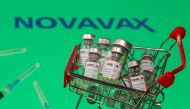 A small shopping basket filled with vials labeled 