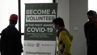 In this picture taken on November 25, 2020 volunteers wait to be administered the new Chinese-made vaccine for the Covid-19 coronavirus, the first ever Phase 3 clinical trial for any vaccine in Pakistan, at a hospital in Islamabad. / AFP / Aamir QURESHI
