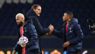 Paris Saint-Germain's French forward Kylian Mbappe (R), Paris Saint-Germain's German coach Thomas Tuchel (C) and Paris Saint-Germain's Brazilian forward Neymar (L) celebrate after winning the UEFA Champions League Group H second-leg football match between
