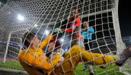 Salzburg's Austrian goalkeeper Cican Stankovic holds the ball after Lokomotiv Moscow's Russian midfielder Anton Miranchuk scored the team's first goal from the penalty spot during the UEFA Champions League football match between Lokomotiv Moscow and Salzb