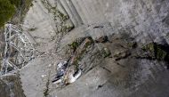 This aerial view shows the damage at the Arecibo Observatory after one of the main cables holding the reciever broke in Arecibo, Puerto Rico, on December 1, 2020. The radio telescope in Puerto Rico, which once starred in a James Bond film, collapsed Tuesd