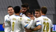 Marseille's French forward Dimitri PAYET (C) is congratulated by teammates after scoring a goal during the UEFA Champions League Group C football match between Olympique de Marseille (OM) and Olympiakos at the Velodrome stadium in Marseille on December 1,