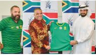 FROM LEFT: Community representative Bradely Habana, South Africa Ambassador to Qatar, H E Faizel Moosa, and QFA General Secretary, Mansoor Al Ansari pose for a group photo.