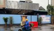 In this photo taken on November 24, 2020, a man wearing face mask as a preventive measure against the Covid-19 coronavirus rides a scooter next to the Huanan Seafood Wholesale Market in Wuhan, in China’s central Hubei province. AFP / Hector Retamal 