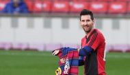 Soccer Football - La Liga Santander - FC Barcelona v Osasuna - Camp Nou, Barcelona, Spain - November 29, 2020 FC Barcelona's Lionel Messi celebrates scoring their fourth goal wearing a Newell's Old Boys shirt in reference to former player Diego Maradona R