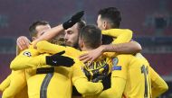 Barcelona's French midfielder Antoine Griezmann (2nd L) celebrates scoring with his team-mates during the UEFA Champions League football match Ferencvaros TC v FC Barcelona in Budapest on December 2, 2020. / AFP / Attila KISBENEDEK

