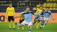 Lazio's Italian forward Ciro Immobile scores a penalty during the UEFA Champions League group F football match BVB Borussia Dortmund v Lazio in Dortmund, western Germany, on December 2, 2020. / AFP / Ina Fassbender
