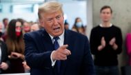 FILE PHOTO: US President Donald Trump points as he visits his campaign headquarters in Arlington, Virginia, November 3, 2020.  AFP / SAUL LOEB